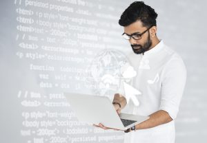 indian software engineer working his laptop